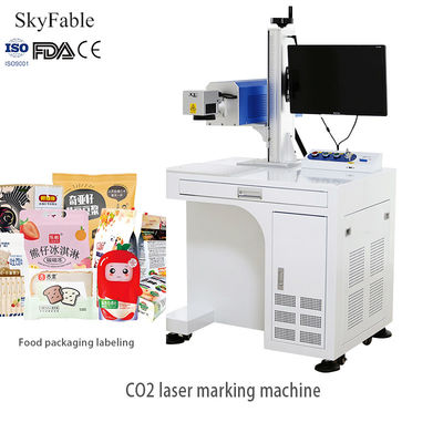 良い値段 高速CO2レーザーマーキングマシン 食品パッケージの日付とバッチ番号の彫刻 オンライン